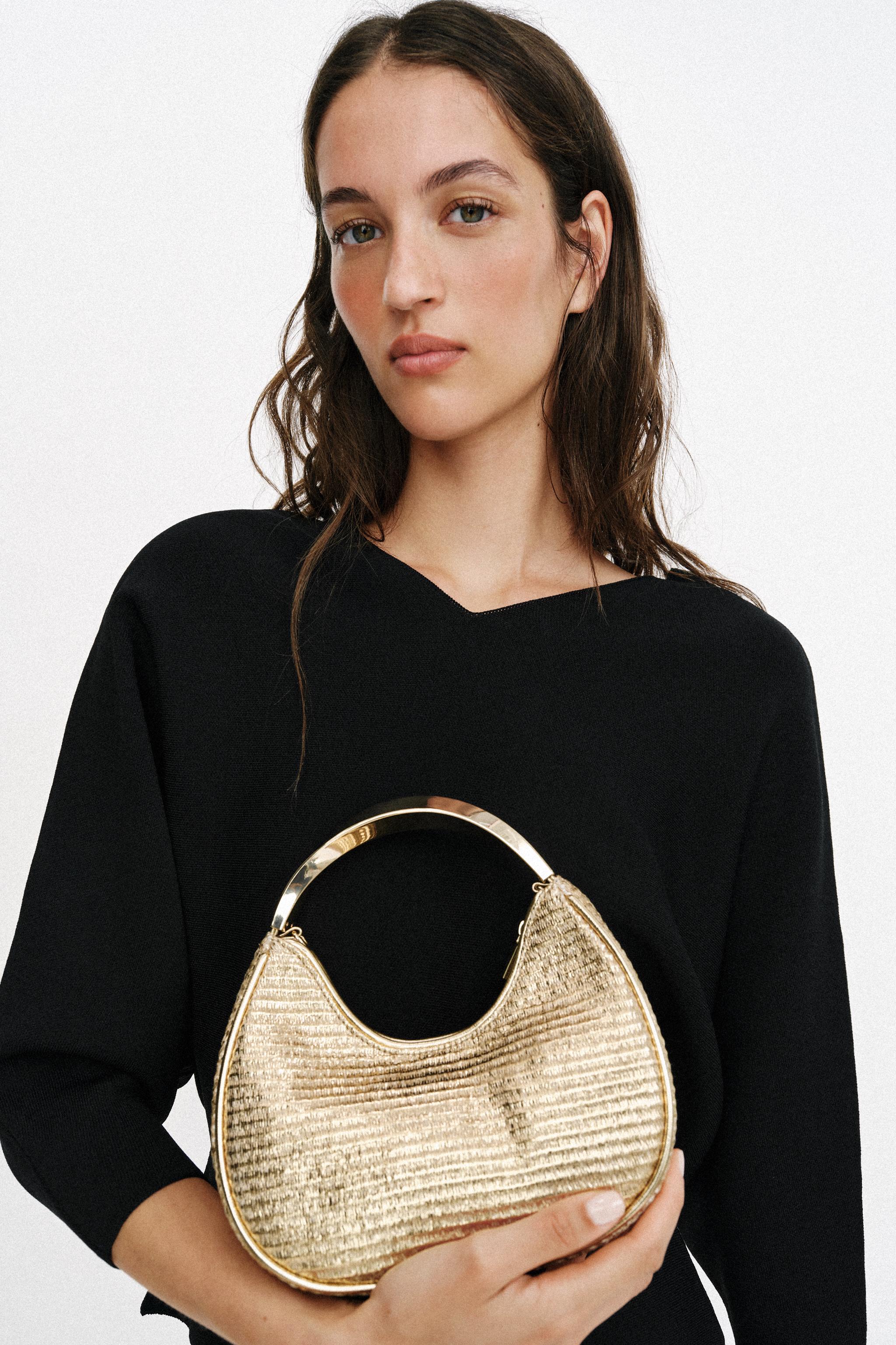 SAC AVEC ANSE MÉTALLIQUE